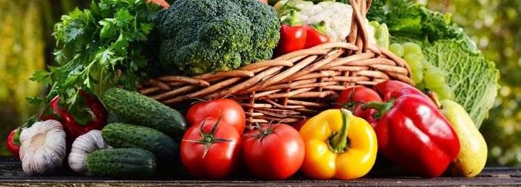 Man holding tomatoes vegetables on table