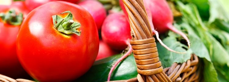 Bright red tomatoes in a bowl Bright red tomatoes like these can benefit from slow-release fertilizers like Milorganite.