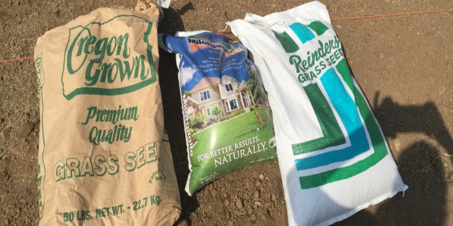 Bags of grass seed and Milorganite fertilizer