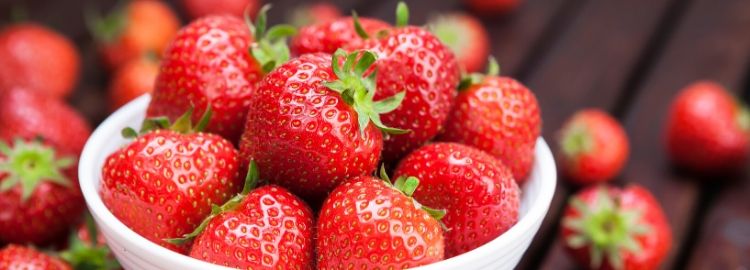 Bright red strawberries Bright red strawberries like these can be fertilized with Milorganite to give them the nutrition they need.