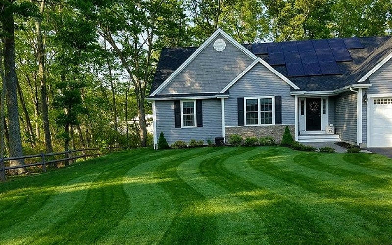Gray house with green lawn