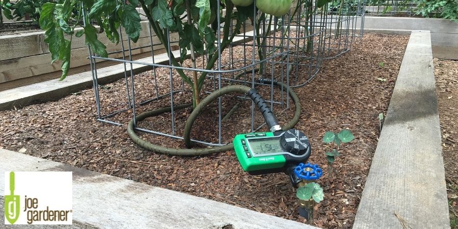 automatic timer on watering house in raised bed garden